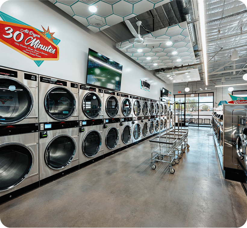 High-performance dryers and rolling carts streamline the laundry in Arizona experience for every customer.