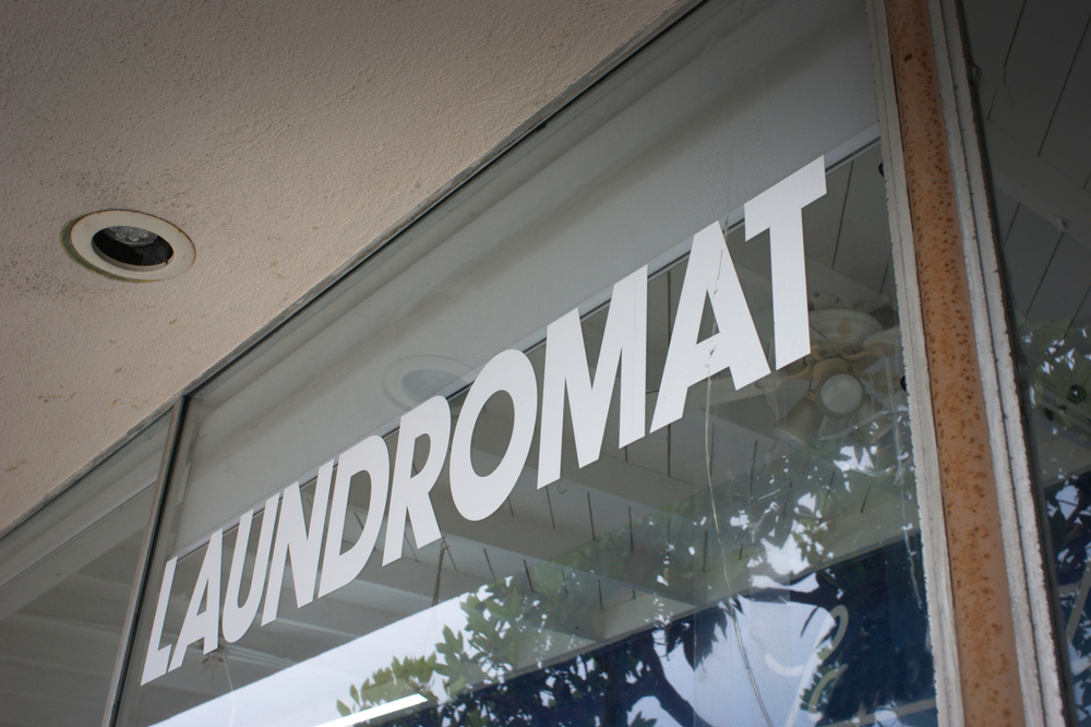 Retro laundromat sign on window