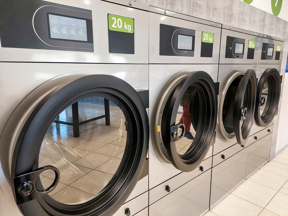 Clean Efficient Industrial Washing Machines in Modern Self-Service Laundry Interior